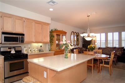 2933 Edgewater Drive Santa Rosa, CA 95407 - Photo 4 of 11 Enticing Kitchen with Stunning Corian Countertops and Center Island, Stainless Steel Appliances, Light Maple Cabinets and Huge Walk-In Pantry.