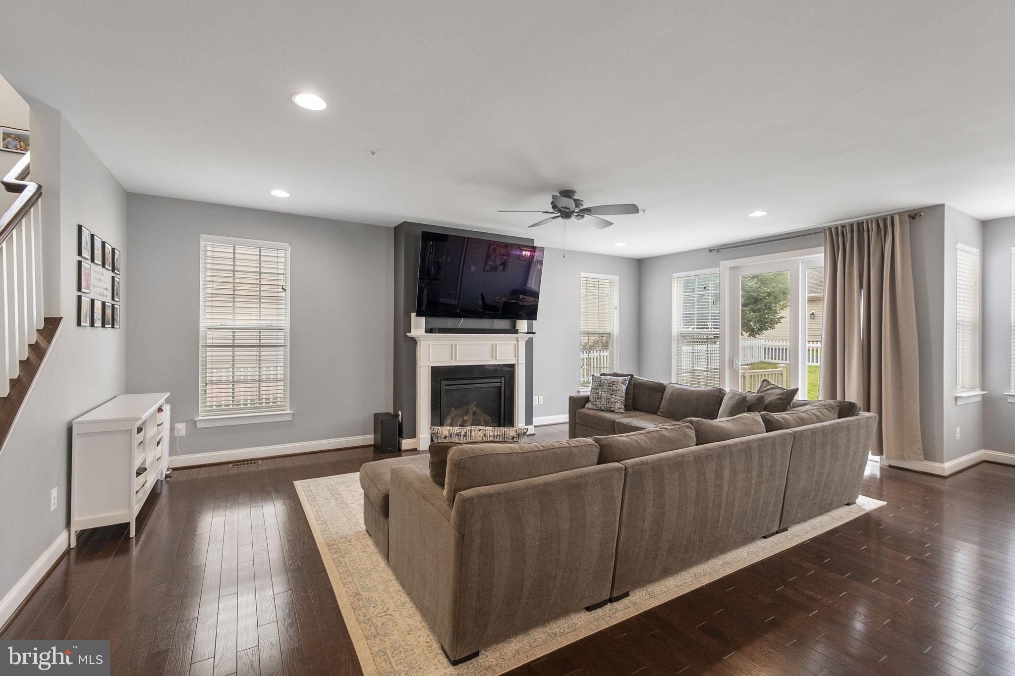 23902 Grapevine Ridge Terrace Clarksburg, MD 20871 - Photo 7 of 44 a living room with furniture and a flat screen tv