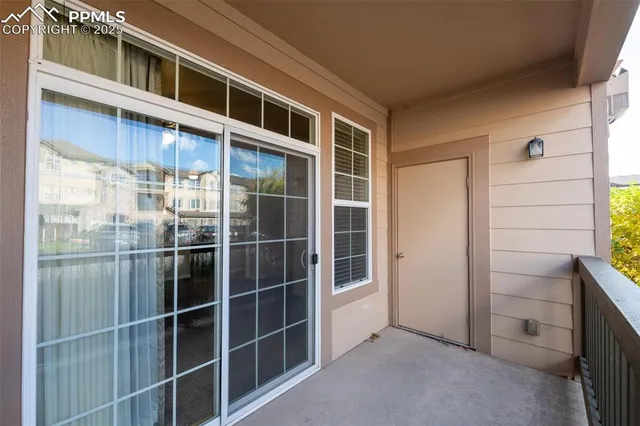 a view of empty room with windows