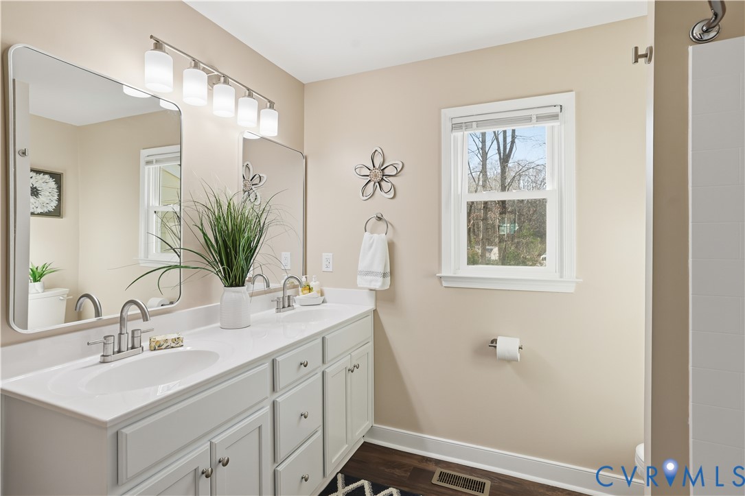 1312 Oldbury Road Midlothian, VA 23113 - Photo 22 of 35 Full bath featuring double vanity and dark wood-st