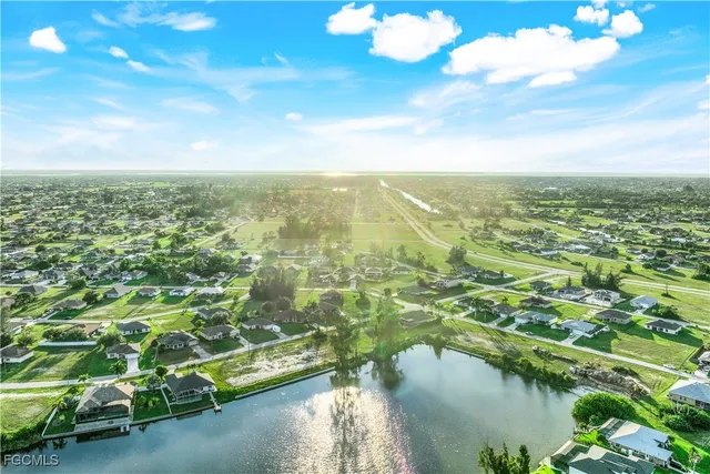 a view of residential houses with lake and ocean view