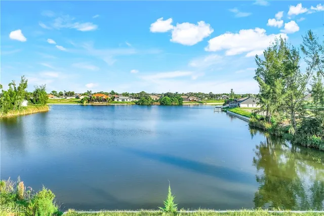 a view of a lake with houses in the back