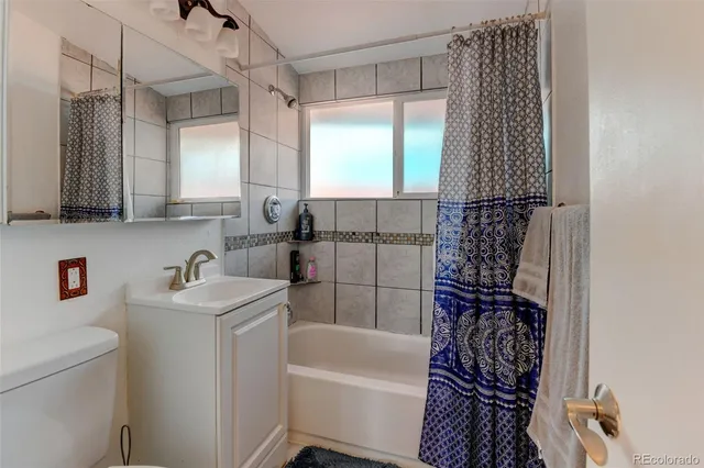 a bathroom with a bathtub a sink and a shower