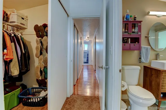 a bathroom with a toilet and a shower curtain