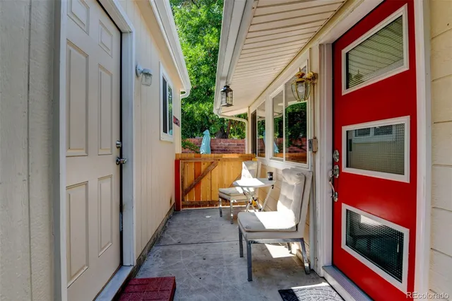 a backyard of a house with outdoor seating