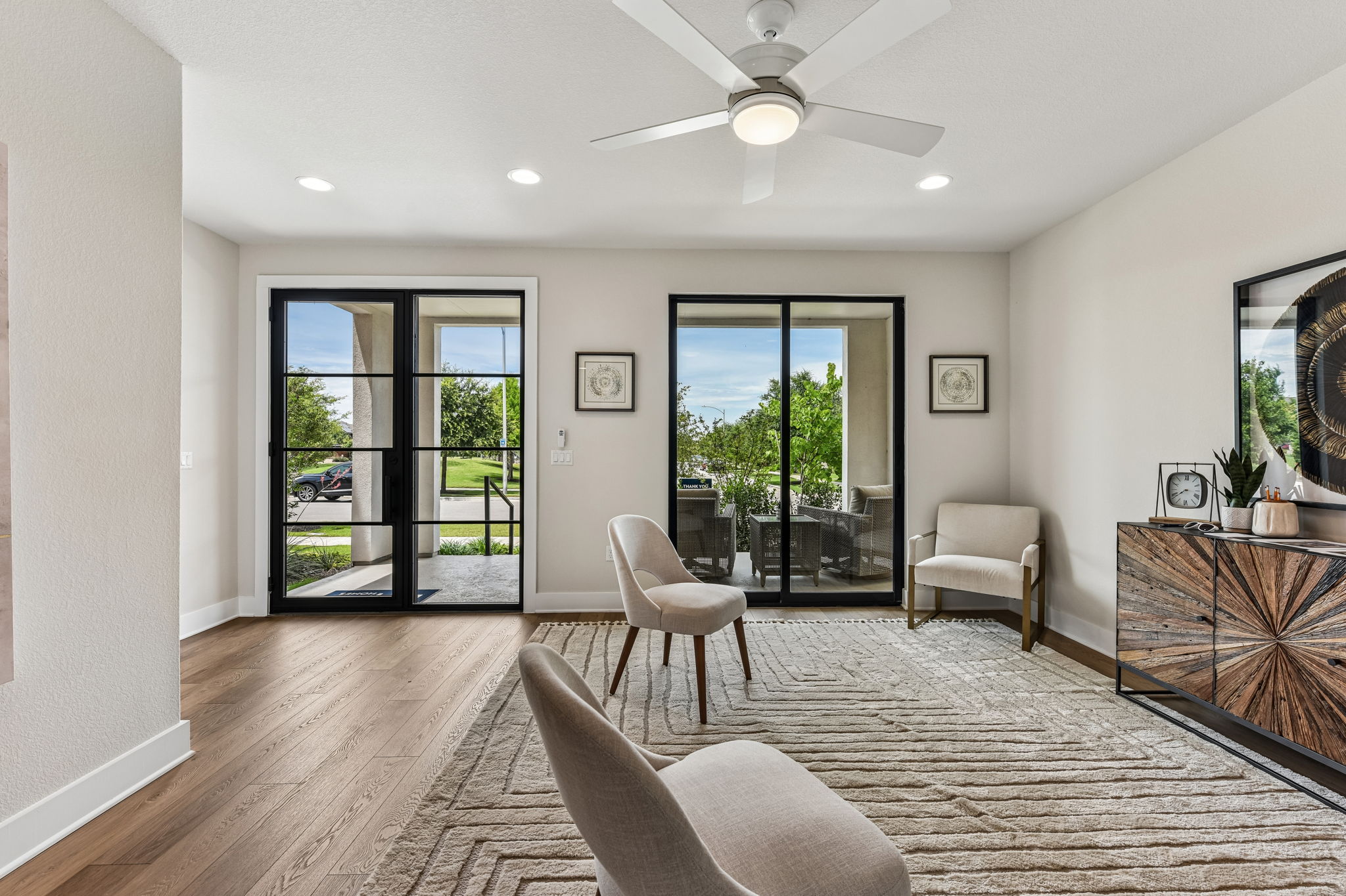 9101 Cattle Baron Path Austin, TX 78747 - Photo 8 of 40 Hardwood floors and generous natural light create an inviting atmosphere.