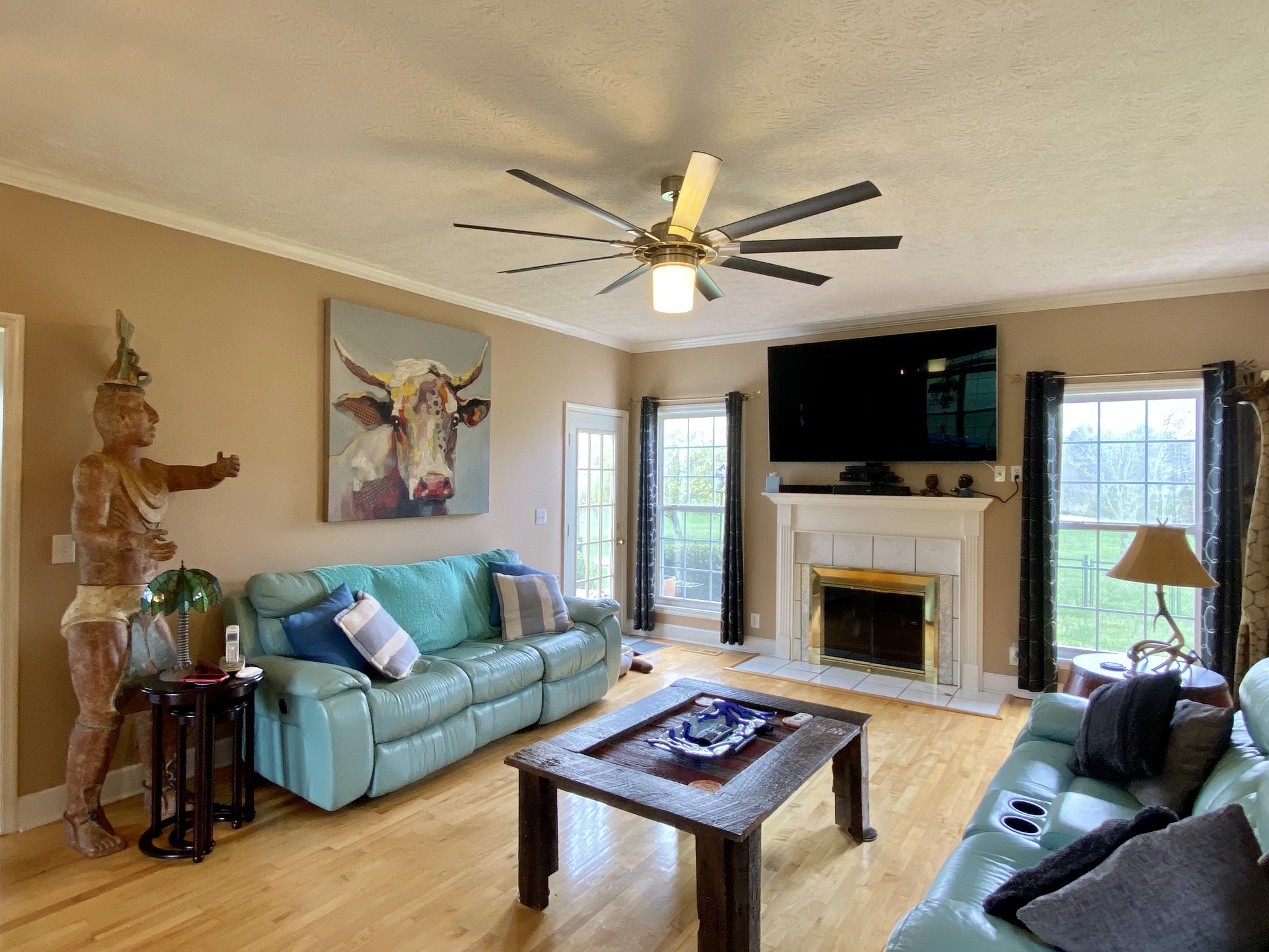 412 Ranch Road Portland, TN 37148 - Photo 17 of 35 a living room with furniture a flat screen tv and a fireplace