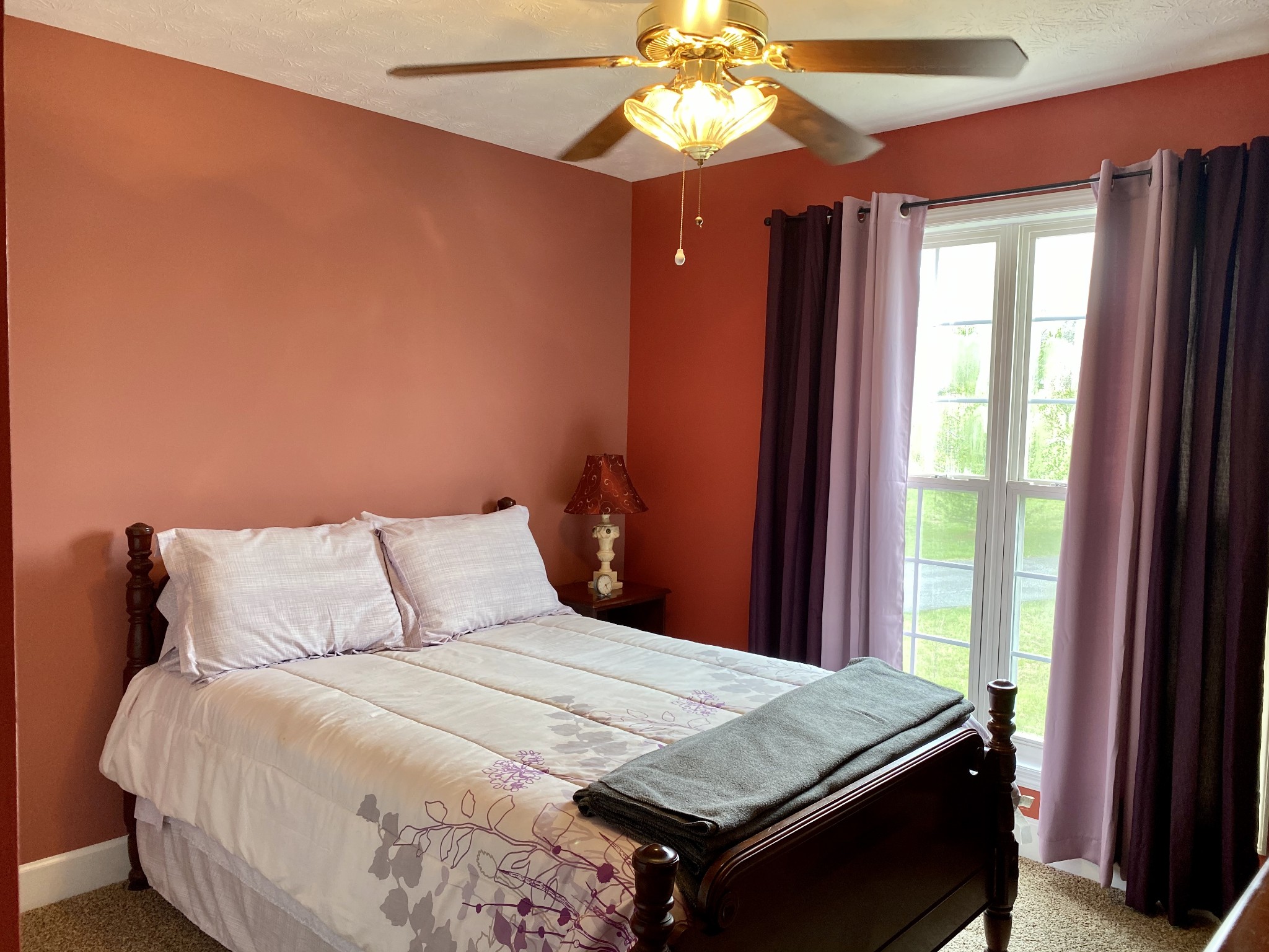 412 Ranch Road Portland, TN 37148 - Photo 26 of 35 a bedroom with a bed and a chandelier