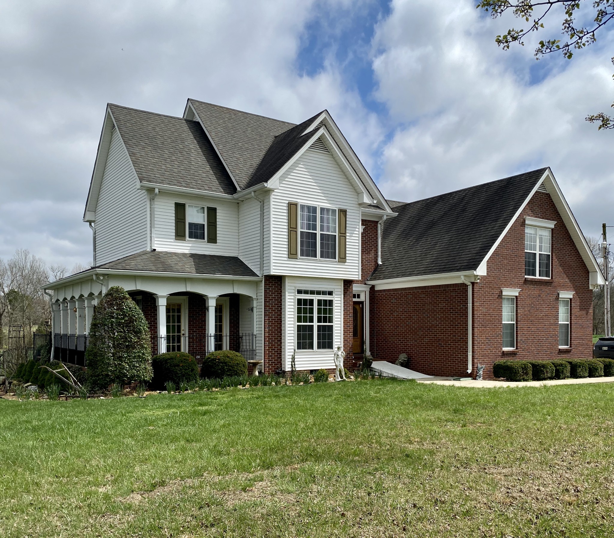 412 Ranch Road Portland, TN 37148 - Photo 27 of 35 a front view of a house with a garden and yard