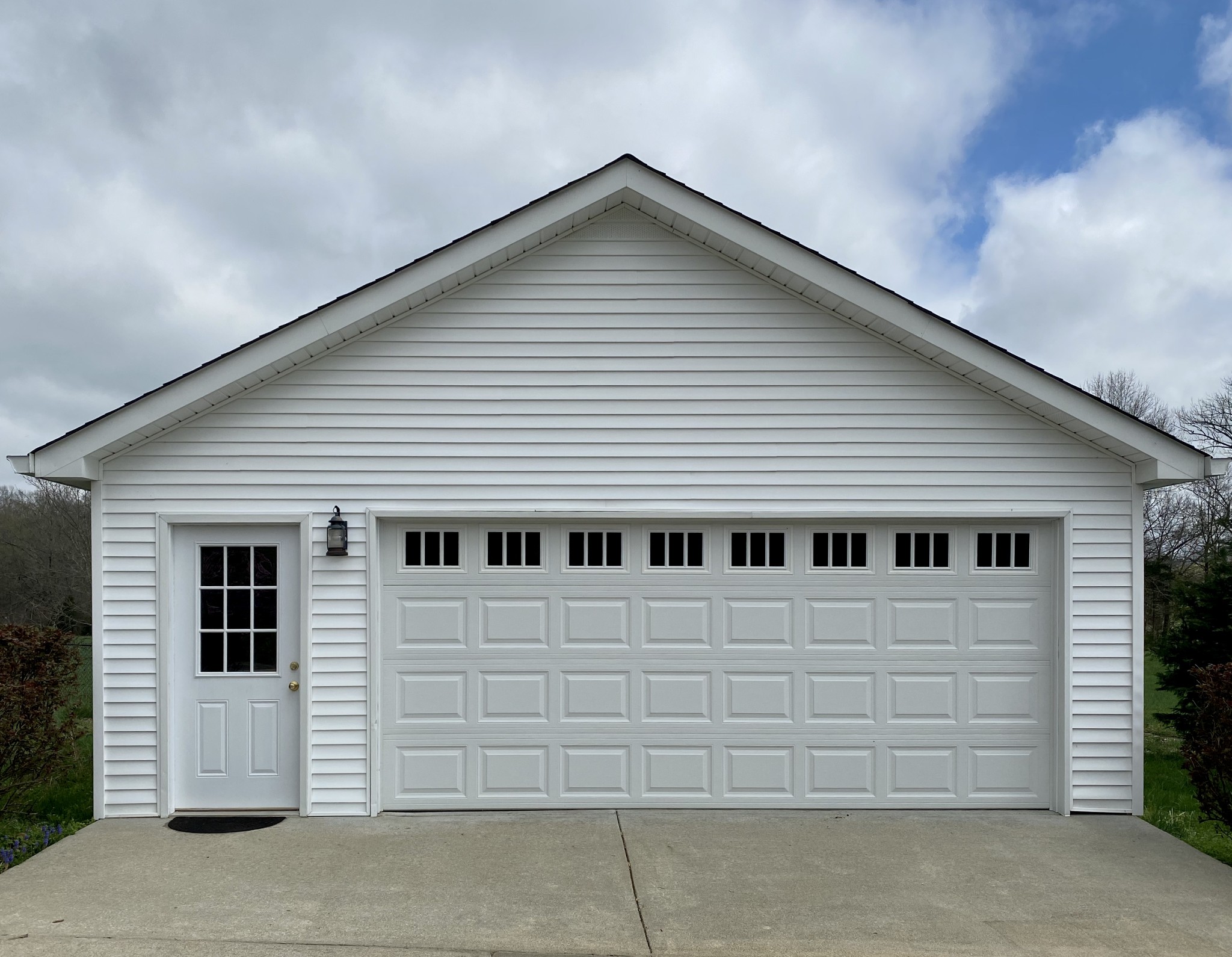 412 Ranch Road Portland, TN 37148 - Photo 6 of 35 a view of a white house with large windows