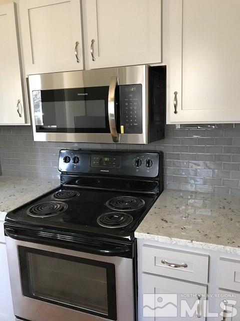 3655 Everett Drive Reno, NV 89503 - Photo 4 of 21 a stove top oven sitting inside of a kitchen