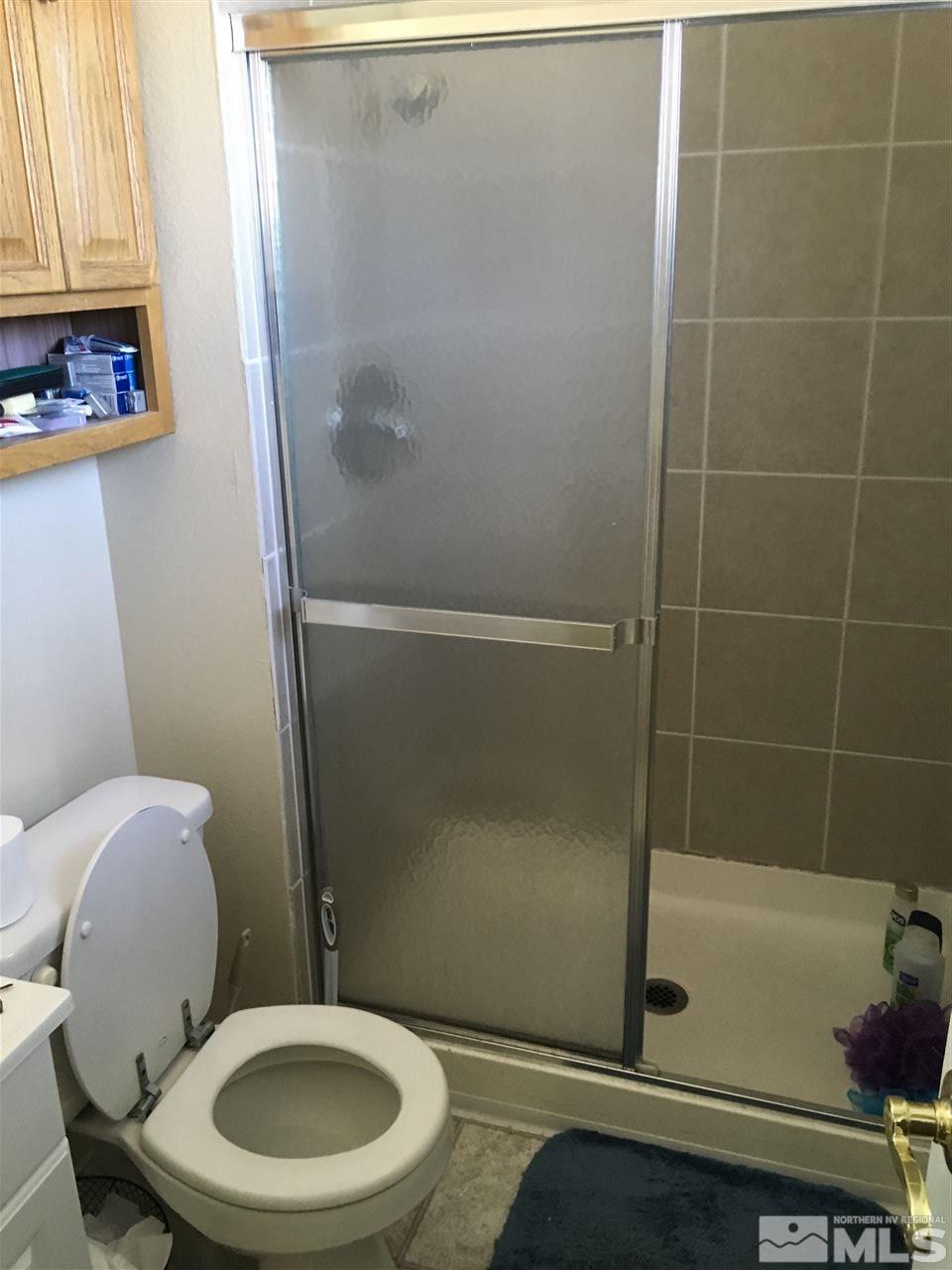 3655 Everett Drive Reno, NV 89503 - Photo 9 of 21 a white toilet sitting next to a bath tub