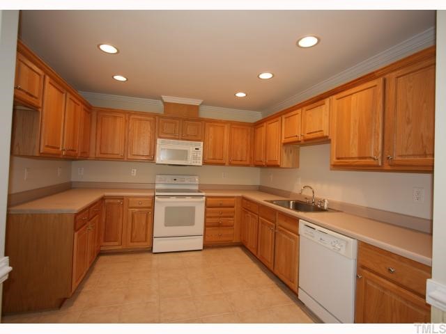 320 Normandy Road Louisburg, NC 27549 - Photo 2 of 12 A large kitchen with a plenty of cabinet space.