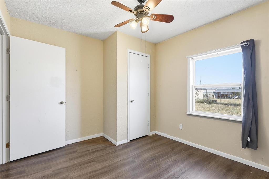 3822 Ragged Rock Court Joshua, TX 76058 - Photo 13 of 34 a view of an empty room with wooden floor and a window