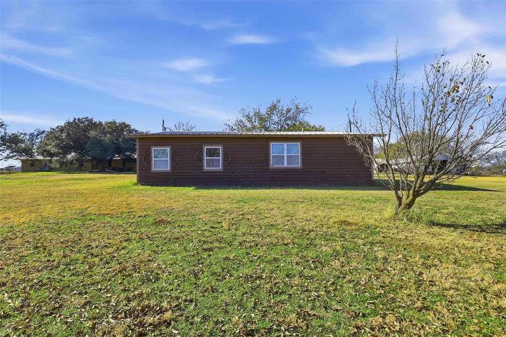 3822 Ragged Rock Court Joshua, TX 76058 - Photo 21 of 34 a view of a house with a yard