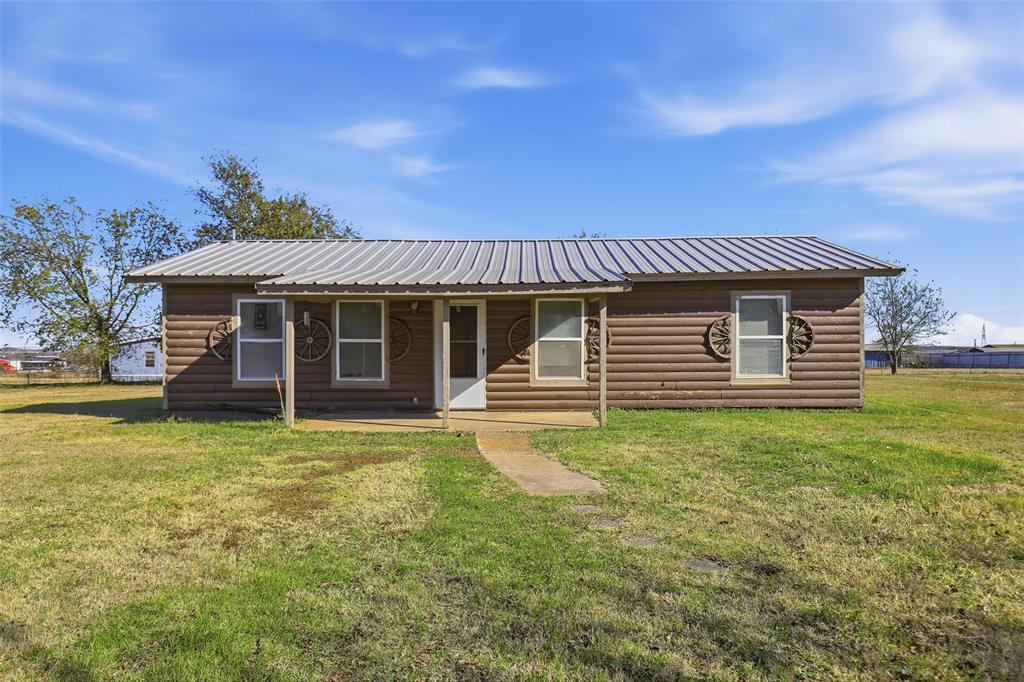3822 Ragged Rock Court Joshua, TX 76058 - Photo 32 of 34 a front view of a house with a garden