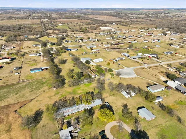 an aerial view of residential building and parking space