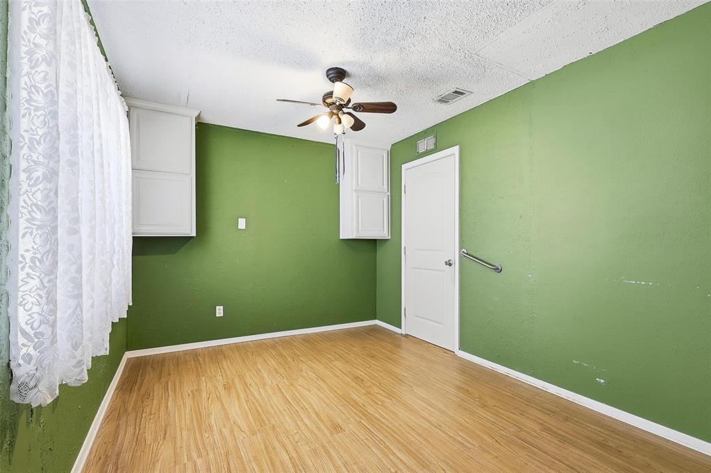 3822 Ragged Rock Court Joshua, TX 76058 - Photo 10 of 34 a bedroom with a bed and a chandelier