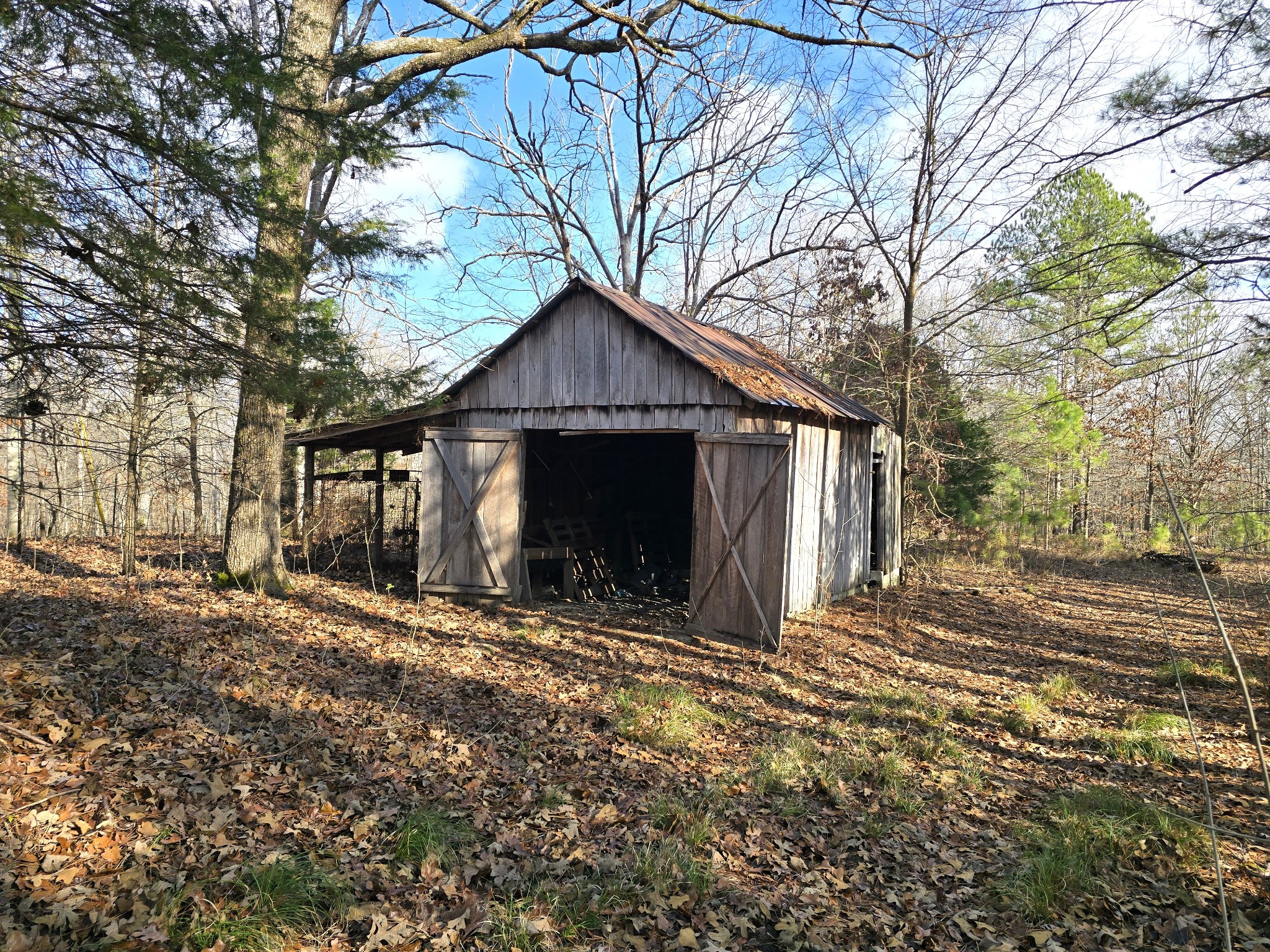 601 Anglin Ridge Road Dover, TN 37058 - Photo 19 of 29 a view of a house with a yard covered in snow