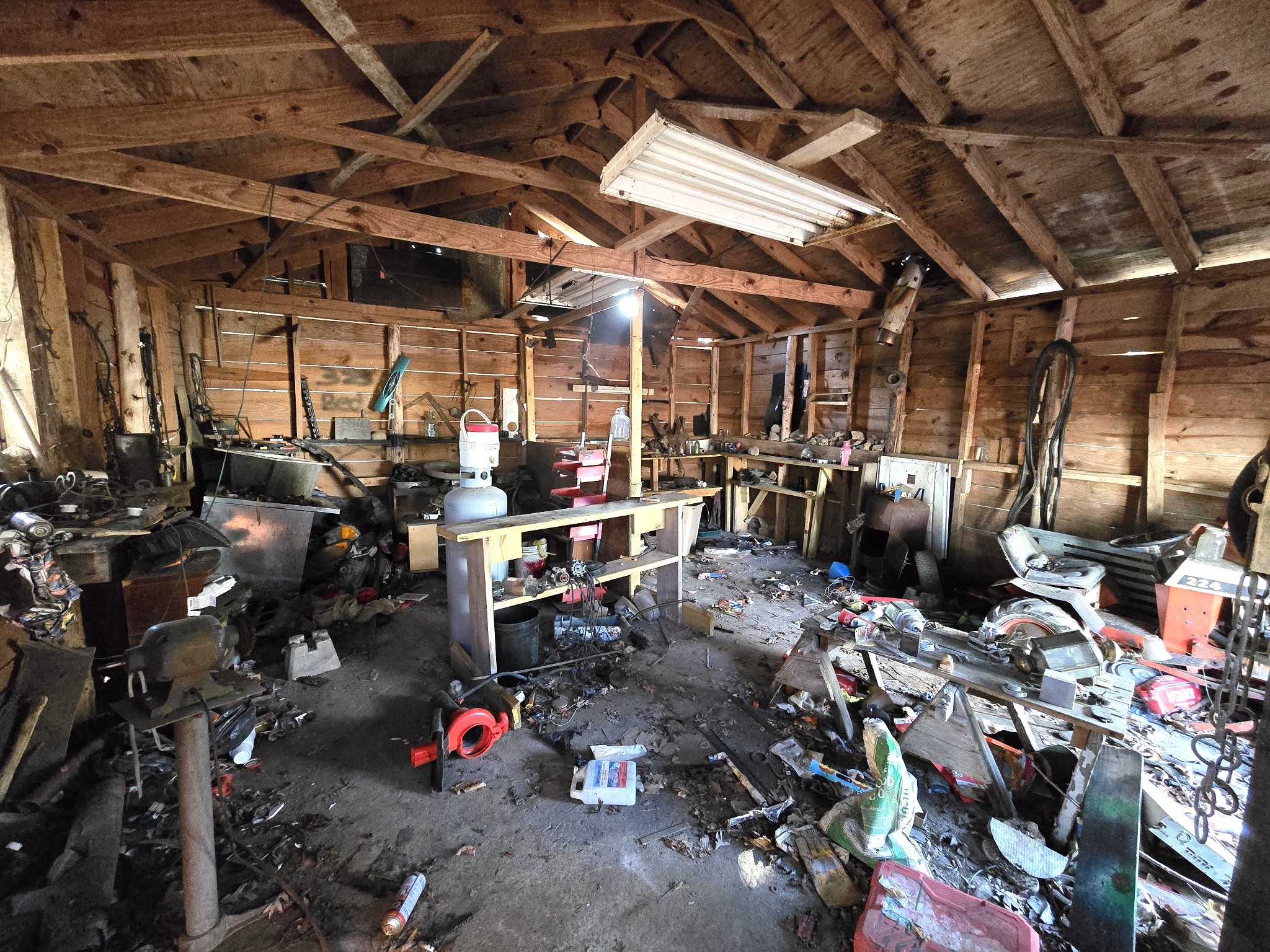 601 Anglin Ridge Road Dover, TN 37058 - Photo 20 of 30 a view of store room with washer and lots of clutter