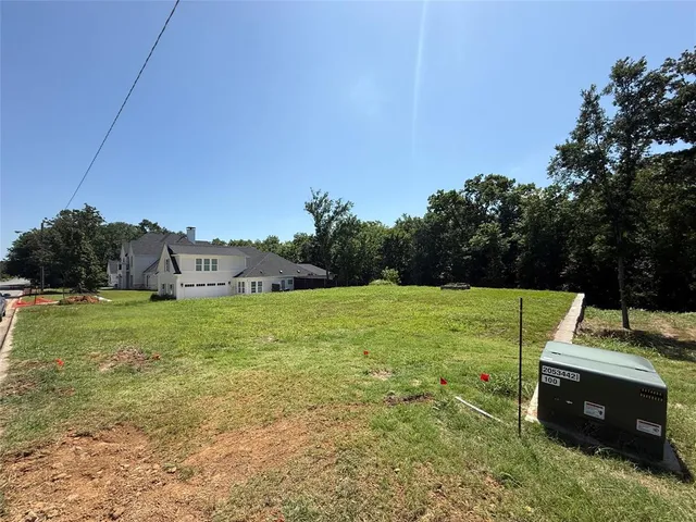 a view of a house with a big yard