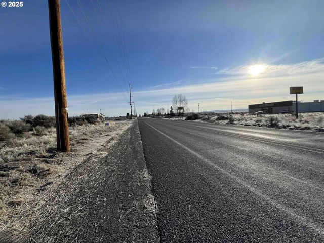 a view of a road with an ocean view