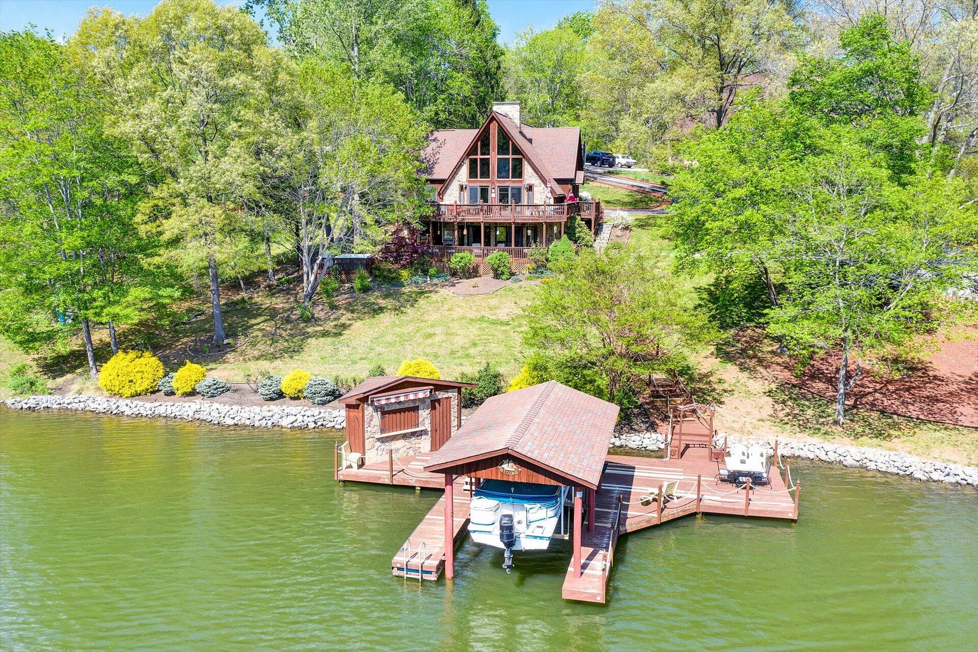 2339 Navigation Point Goodview, VA 24095 - Photo 1 of 49 a aerial view of a house with swimming pool a yard and lake view