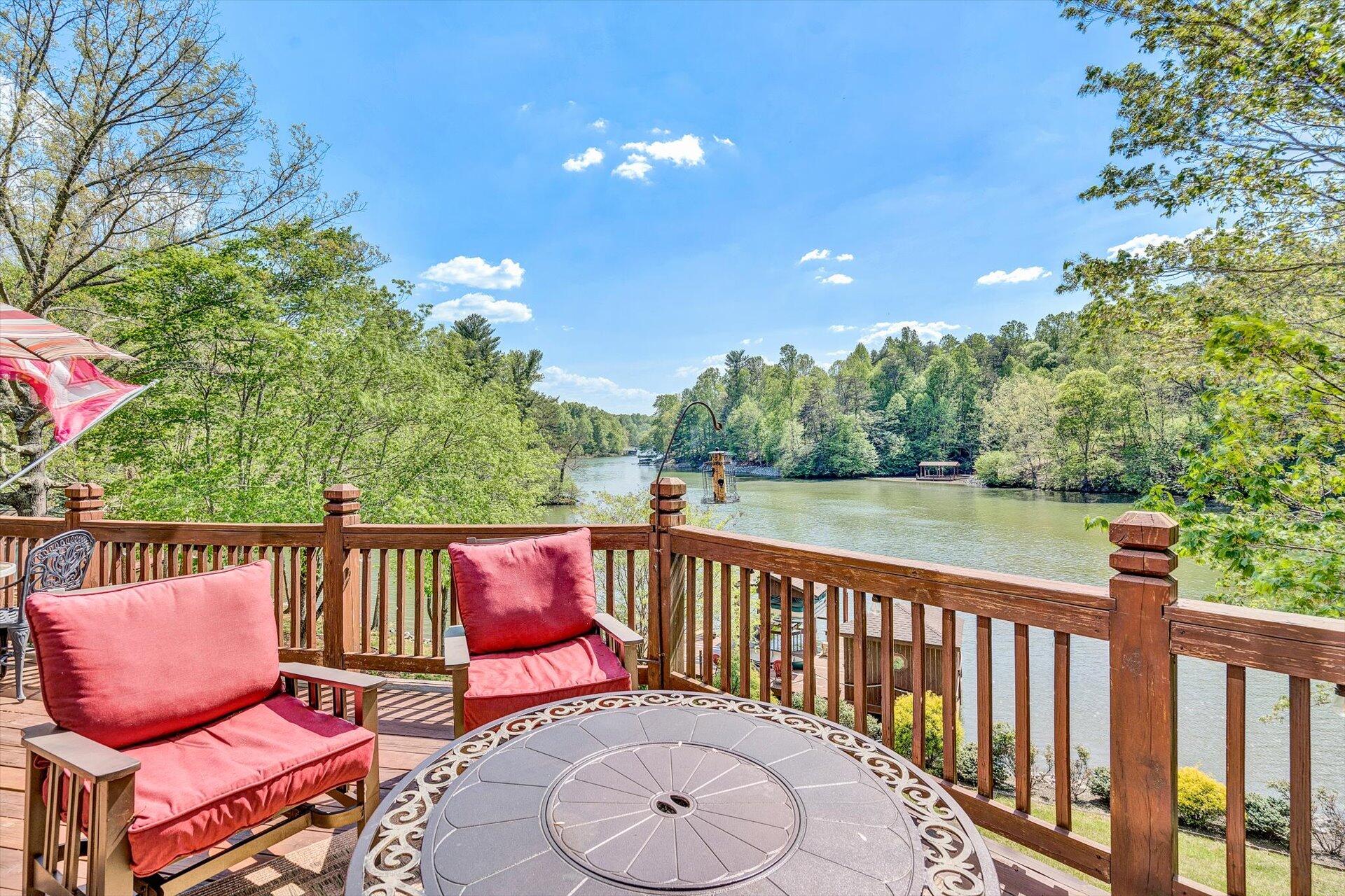 2339 Navigation Point Goodview, VA 24095 - Photo 20 of 49 a balcony with wooden floor table and chairs
