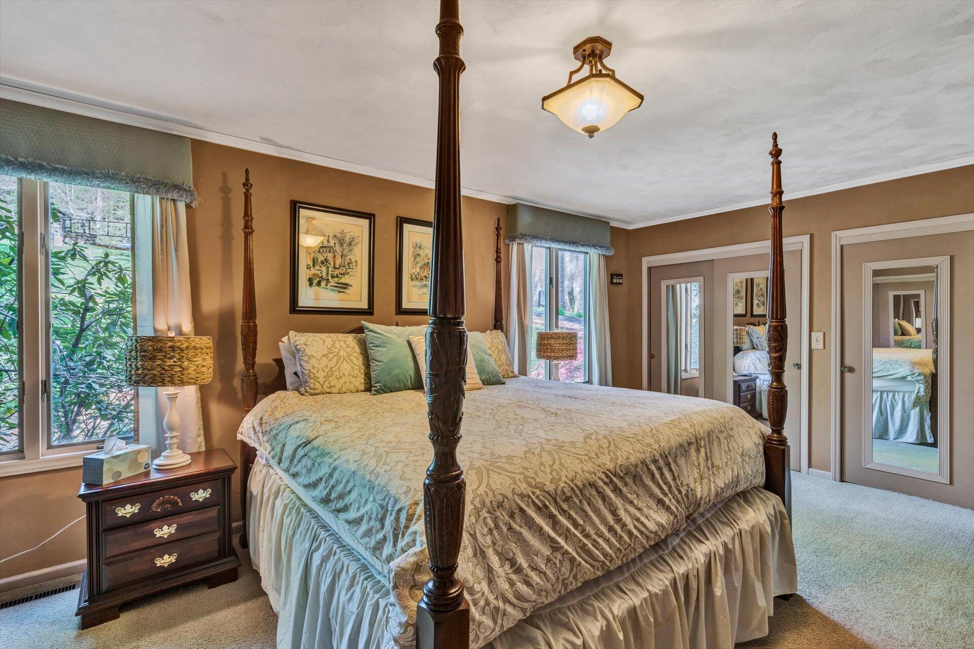2339 Navigation Point Goodview, VA 24095 - Photo 21 of 49 a bedroom with a bed and large windows