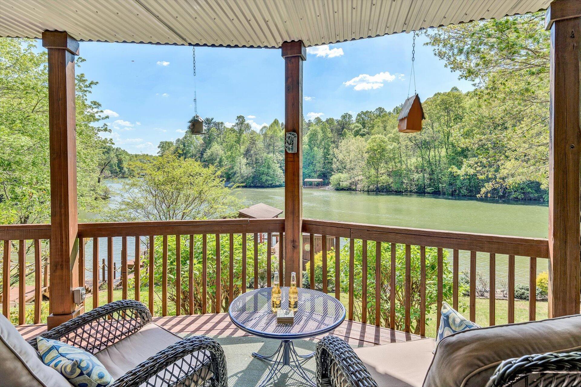 2339 Navigation Point Goodview, VA 24095 - Photo 4 of 49 a view of a balcony with chair and wooden floor