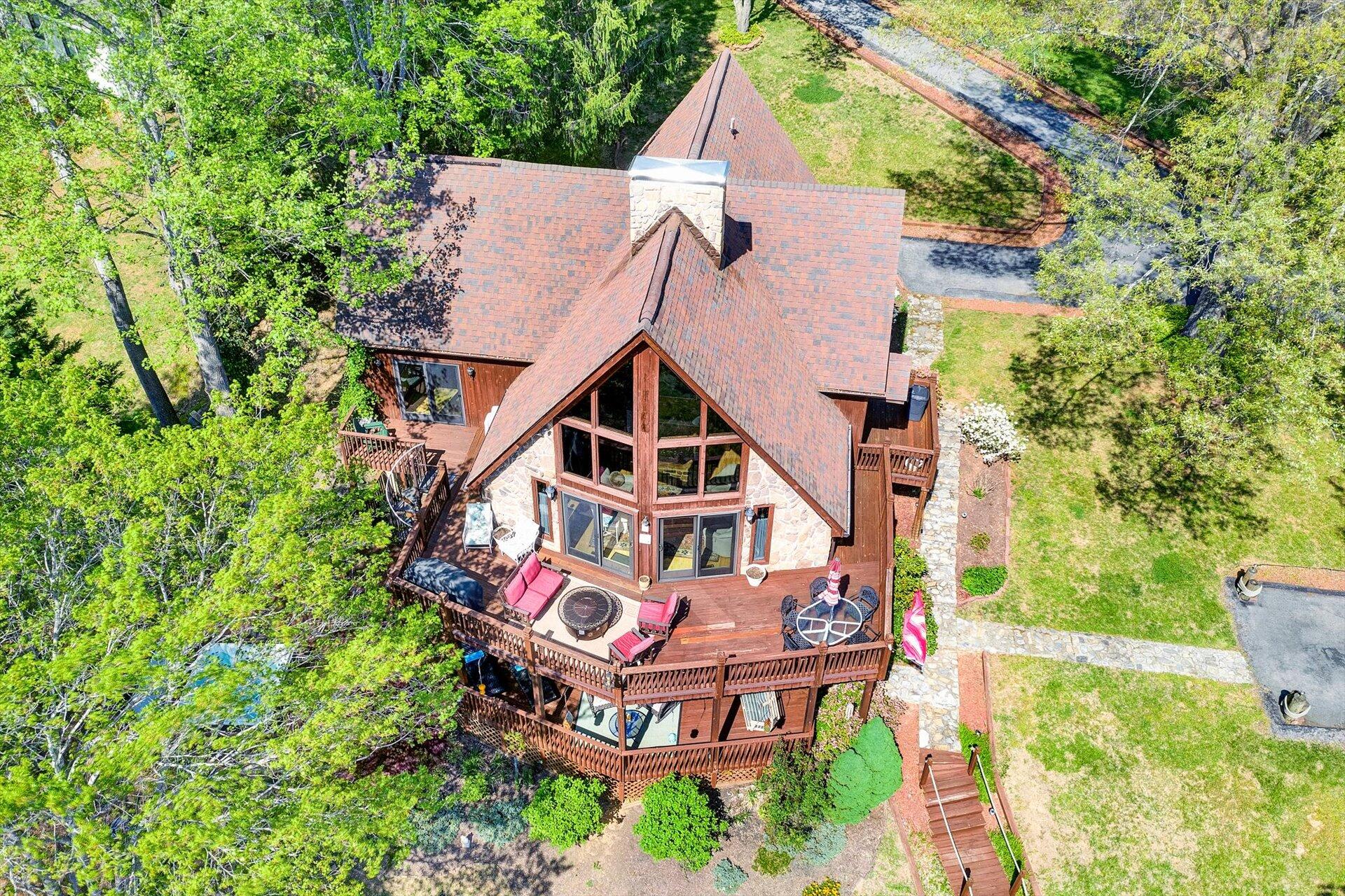 2339 Navigation Point Goodview, VA 24095 - Photo 46 of 49 an aerial view of a house with a big yard and large trees