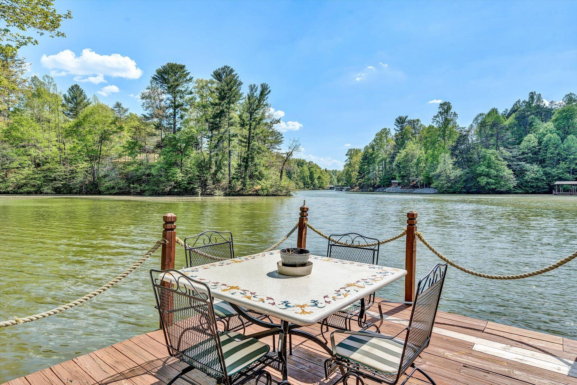 2339 Navigation Point Goodview, VA 24095 - Photo 6 of 49 a view of a lake with a table and chairs
