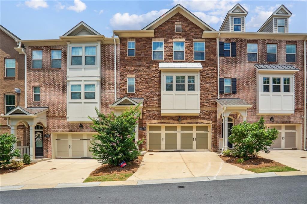 1338 Rosen Road Brookhaven, GA 30319 - Photo 1 of 1 a front view of a house with a yard