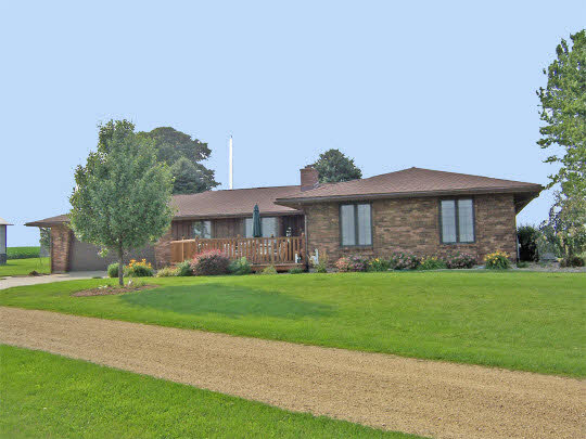 58 North Maryland Road Polo, IL 61064 - Photo 1 of 6 a front view of a house with a garden