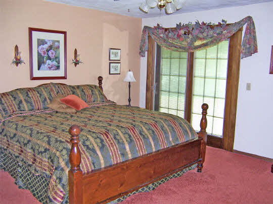 58 North Maryland Road Polo, IL 61064 - Photo 4 of 6 a bed sitting in a bedroom next to a window