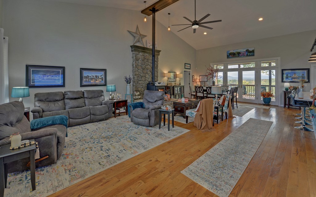 280 Cherokee Court Ellijay, GA 30540 - Photo 2 of 73 a living room with lots of furniture and a wooden floor
