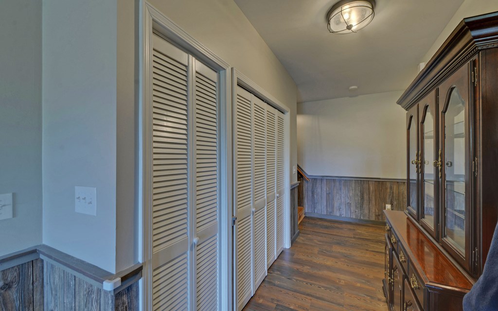 280 Cherokee Court Ellijay, GA 30540 - Photo 30 of 73 a view of a hallway with wooden floor and staircase