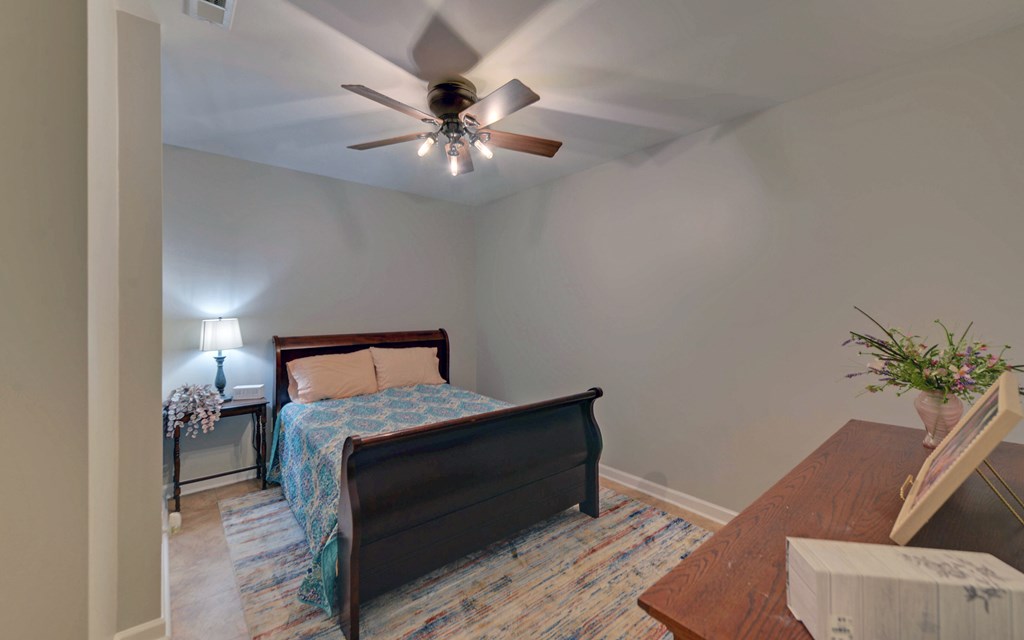 280 Cherokee Court Ellijay, GA 30540 - Photo 37 of 73 a bedroom with a bed and a potted plant