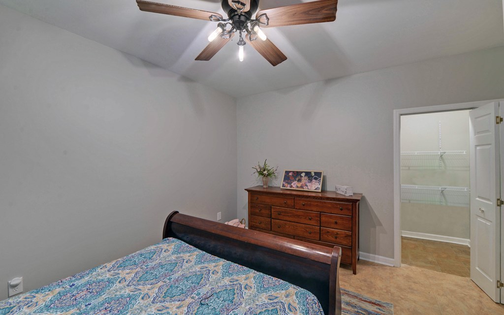 280 Cherokee Court Ellijay, GA 30540 - Photo 38 of 73 a bedroom with a bed and a chandelier