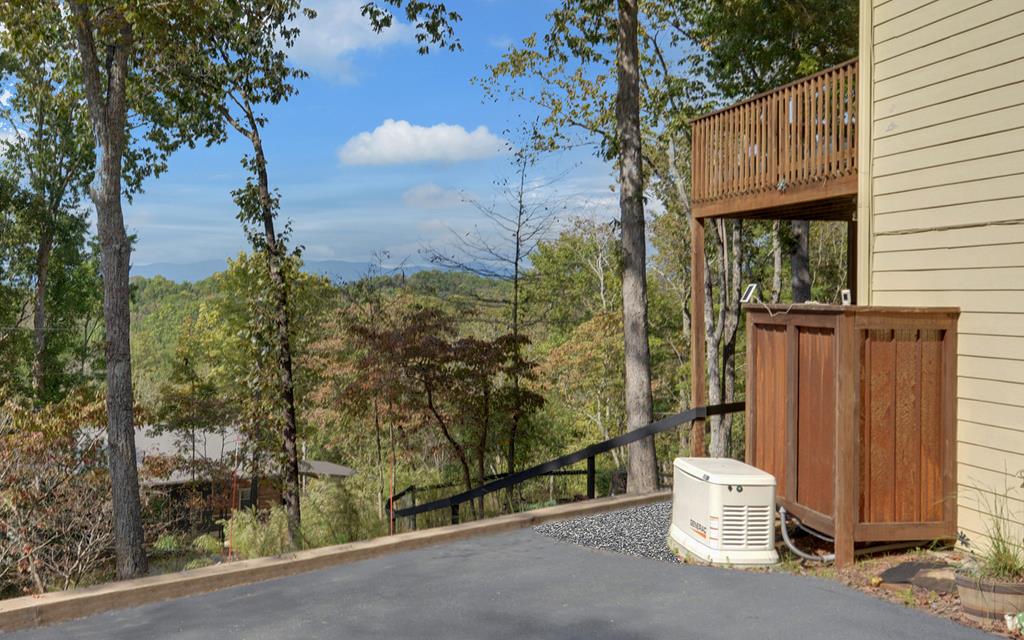280 Cherokee Court Ellijay, GA 30540 - Photo 49 of 73 a view of a back yard of the house and a tree