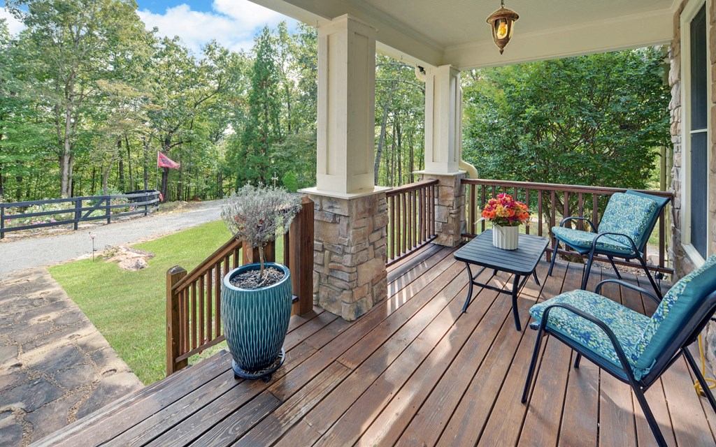 280 Cherokee Court Ellijay, GA 30540 - Photo 7 of 73 a view of a chairs and table on the roof deck