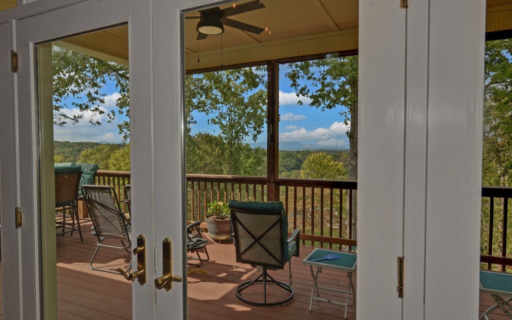 280 Cherokee Court Ellijay, GA 30540 - Photo 8 of 73 a view of a chairs and table in a balcony