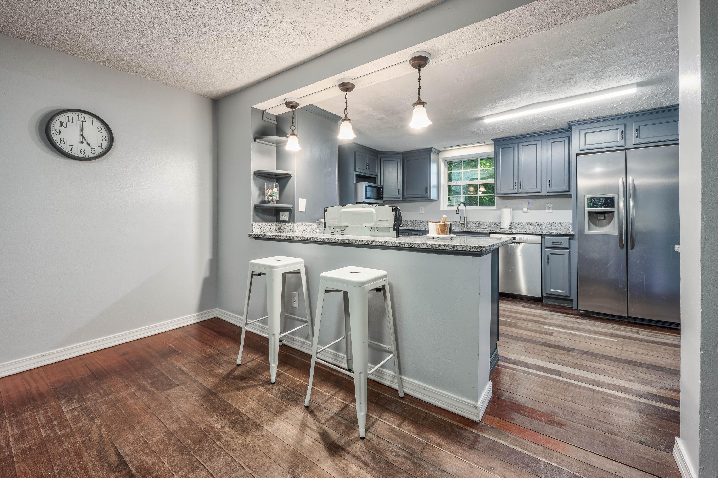 1838 Wadsworth Road Baker, FL 32531 - Photo 3 of 71 a kitchen with kitchen island granite countertop a sink cabinets and stainless steel appliances