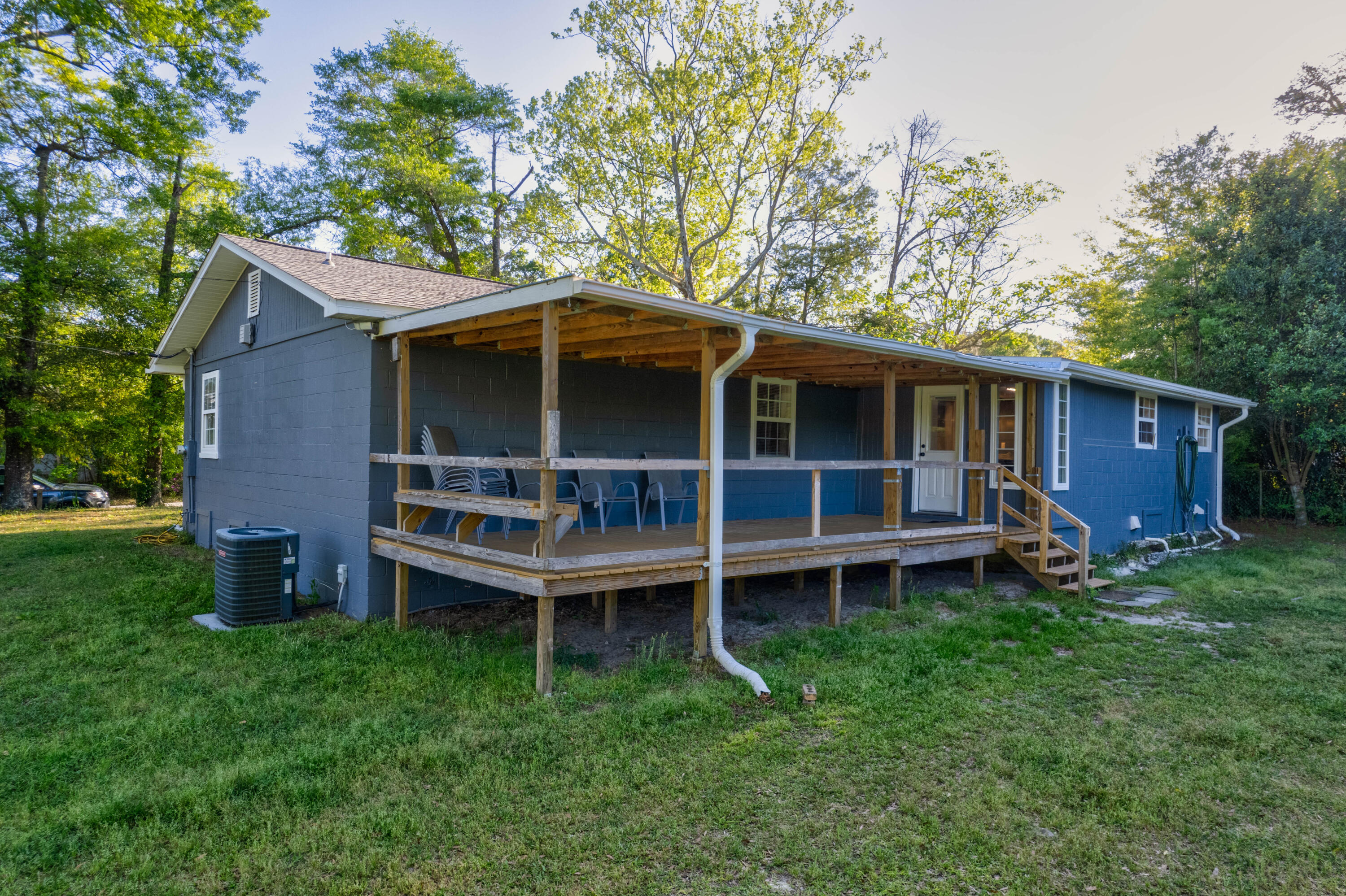 1838 Wadsworth Road Baker, FL 32531 - Photo 49 of 71 a wooden house with a big yard and large trees