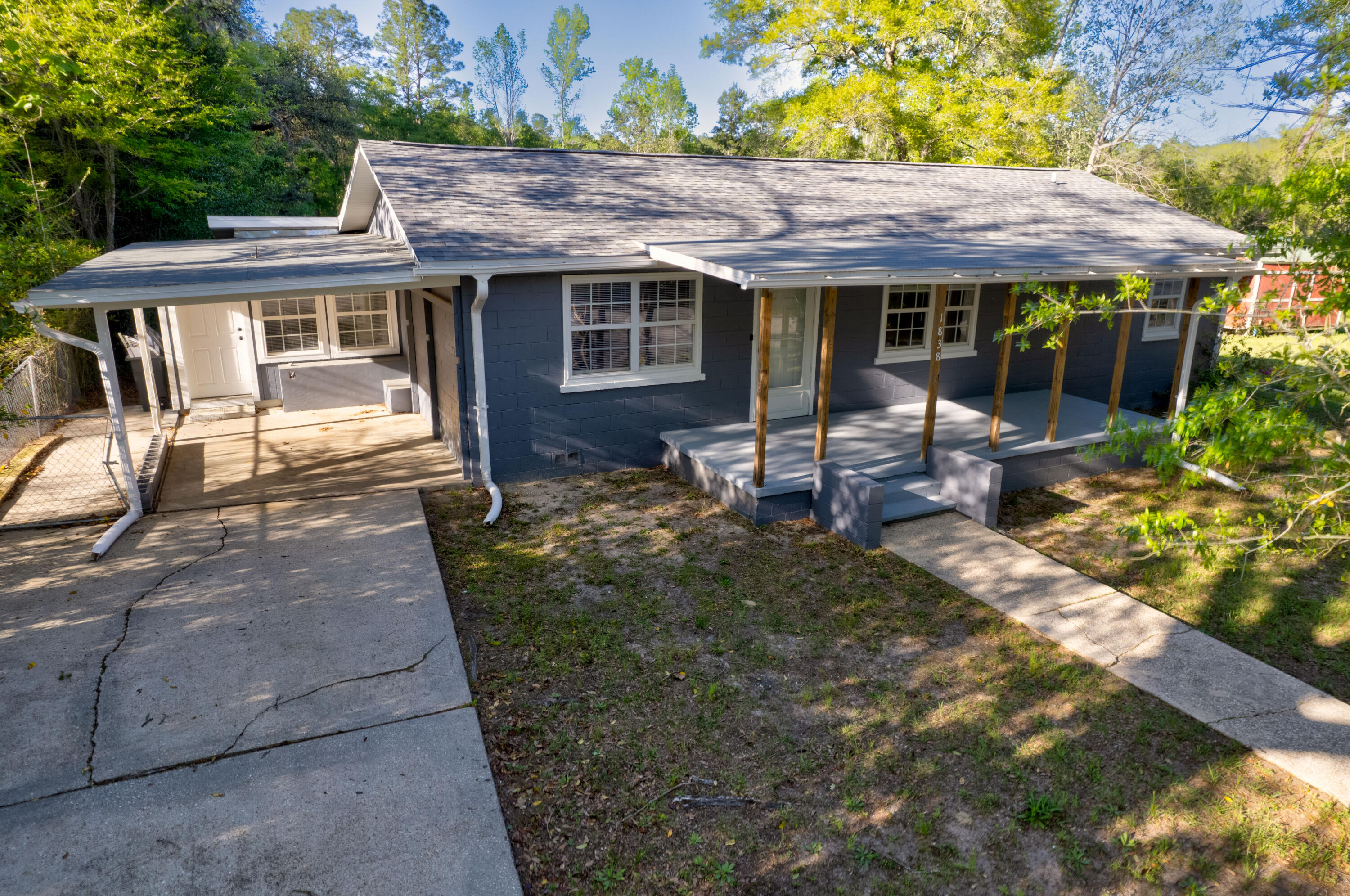 1838 Wadsworth Road Baker, FL 32531 - Photo 7 of 71 a front view of a house with garden