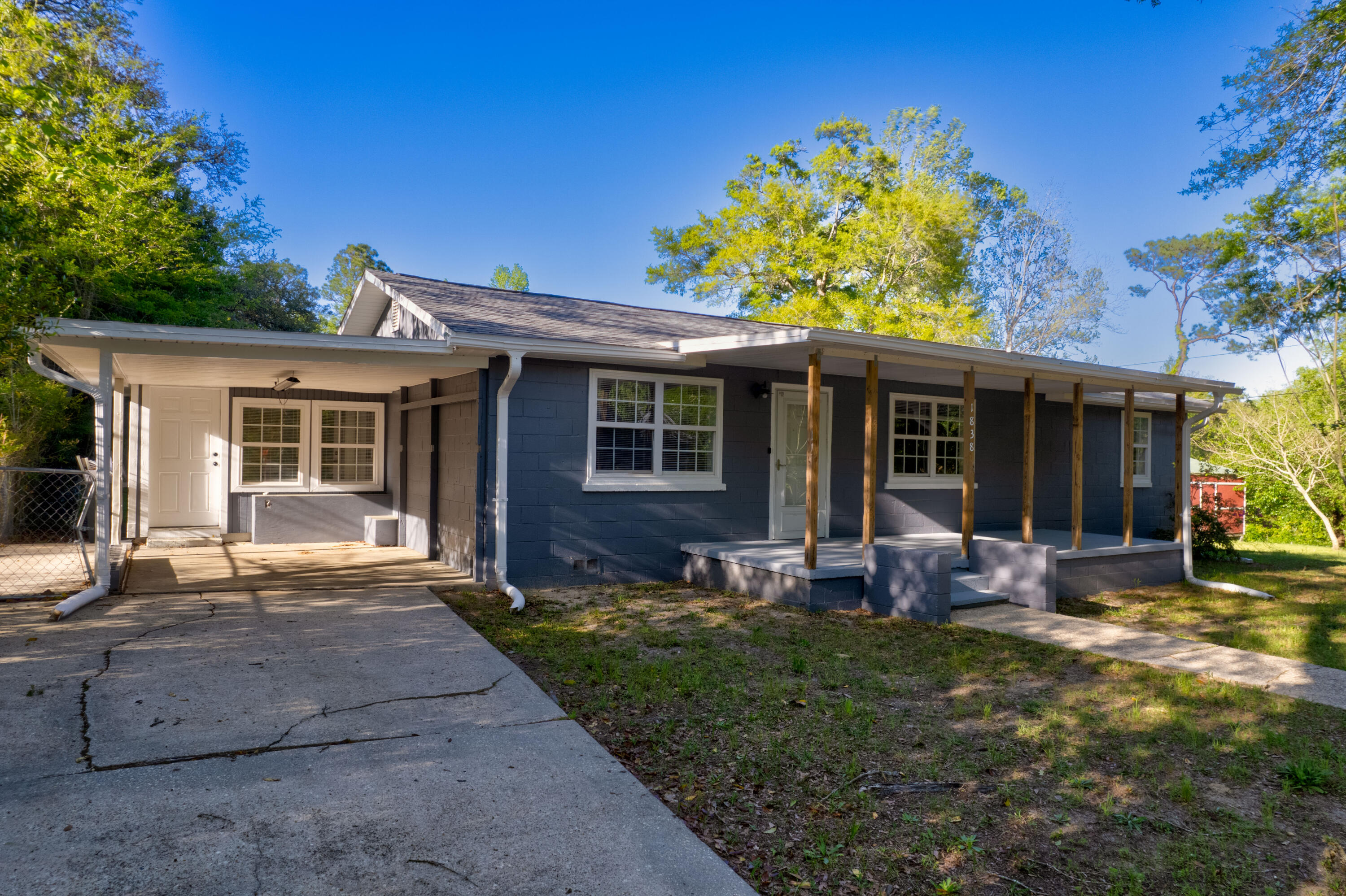 1838 Wadsworth Road Baker, FL 32531 - Photo 8 of 71 a front view of a house with garden