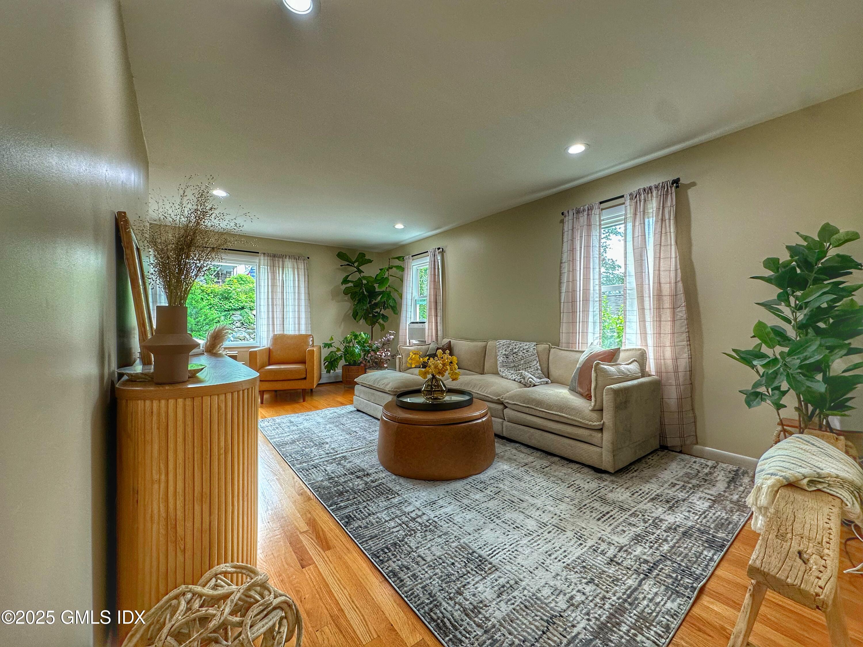 37 Gerry Street, Unit 1 Greenwich, CT 06830 - Photo 1 of 19 a living room with furniture and a potted plant