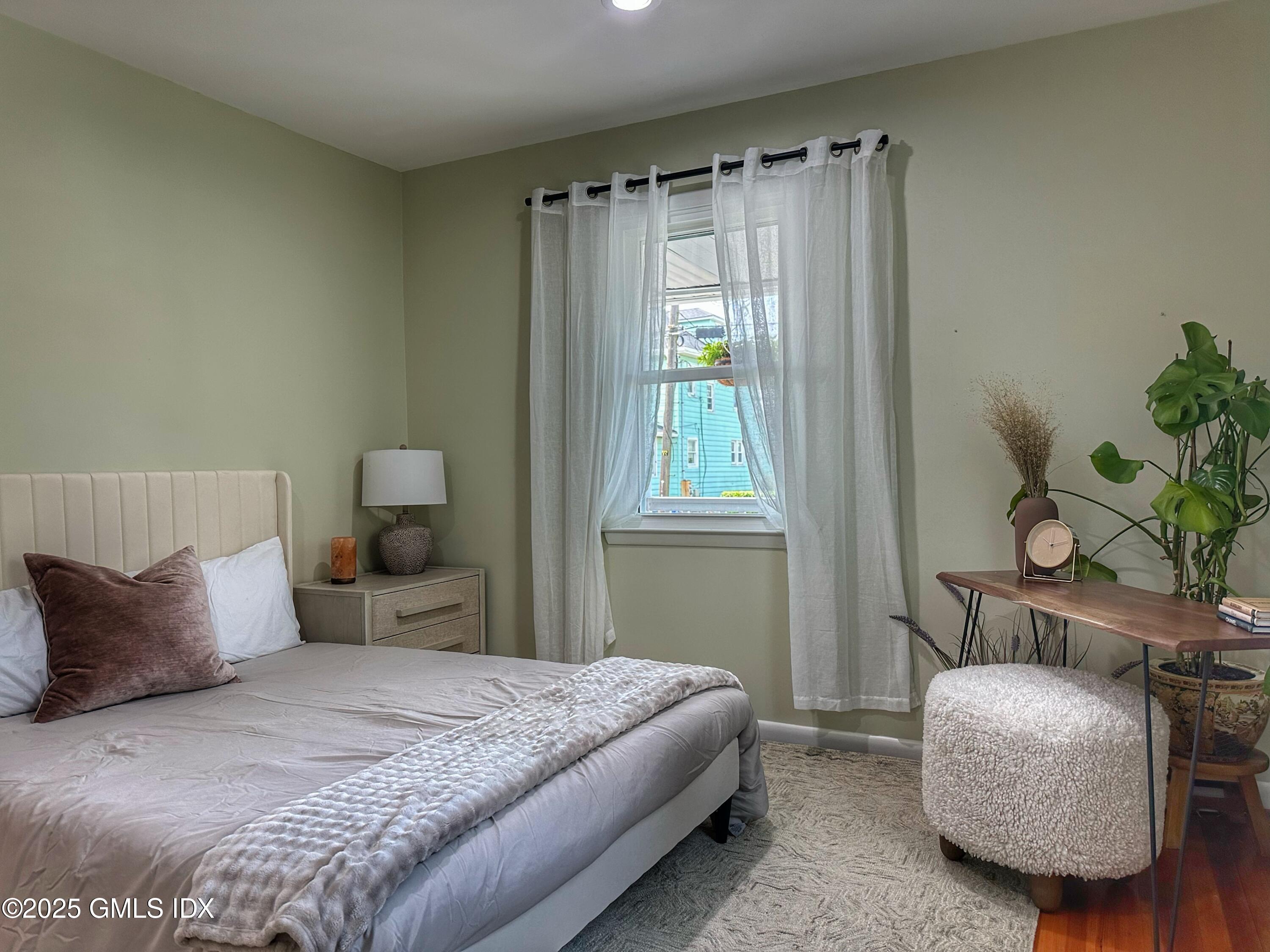 37 Gerry Street, Unit 1 Greenwich, CT 06830 - Photo 11 of 19 a bedroom with a bed and a window