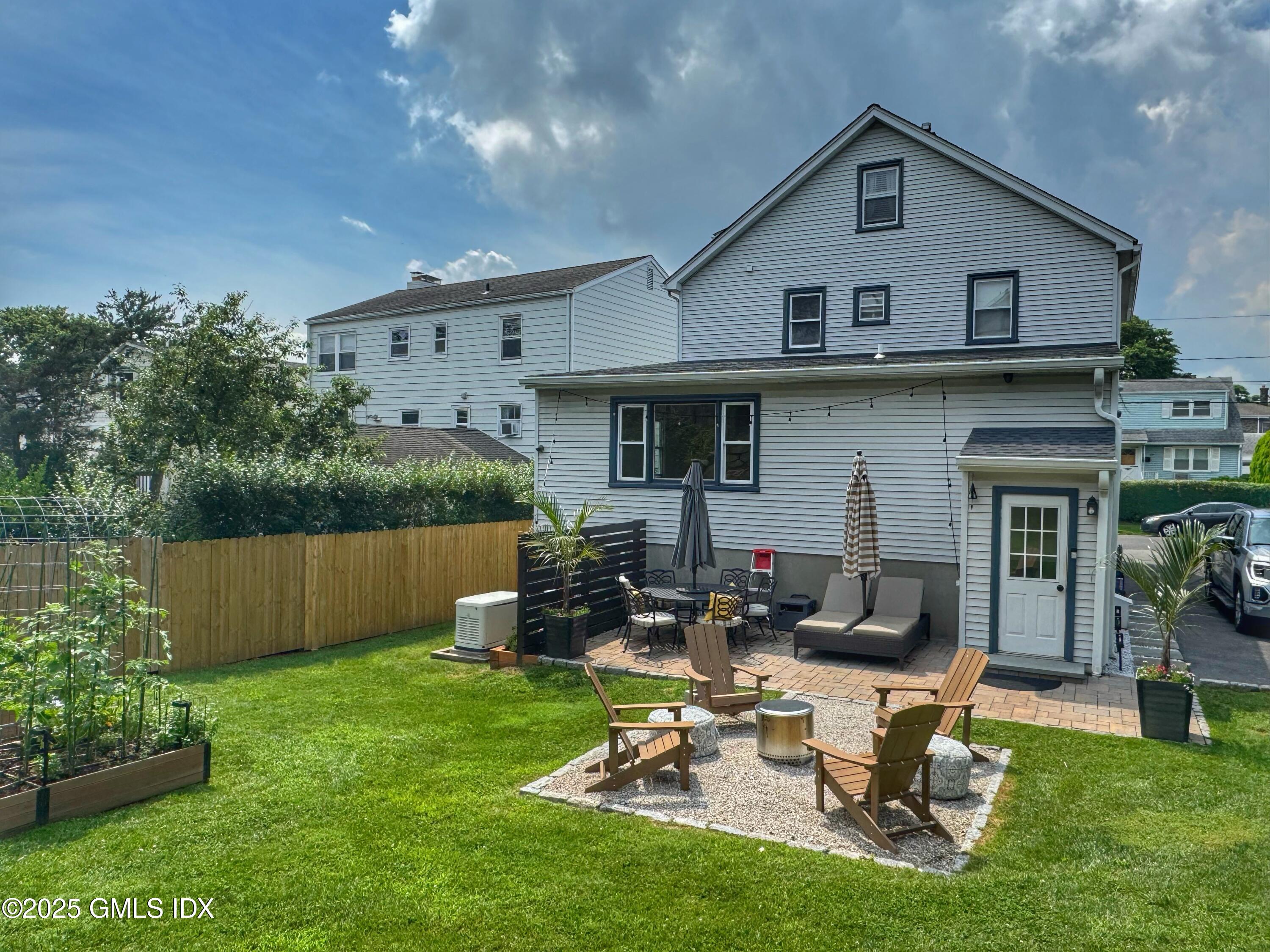 37 Gerry Street, Unit 1 Greenwich, CT 06830 - Photo 18 of 19 a view of a house with backyard and sitting area