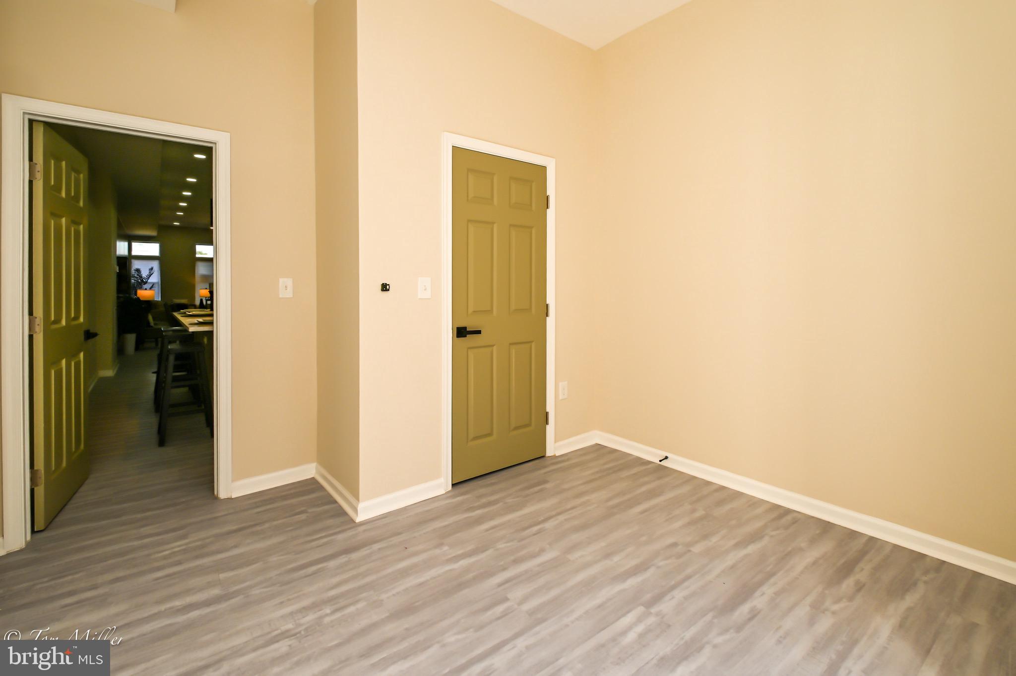 1743 Federal Street Baltimore, MD 21213 - Photo 11 of 42 a view of an empty room with wooden floor
